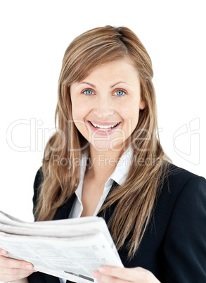 Joyful businesswoman reading a newspaper