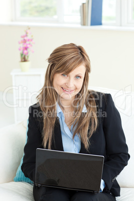 Sophisticated businesswoman using her laptop