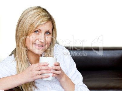 Self-assured woman holding a cup of coffee