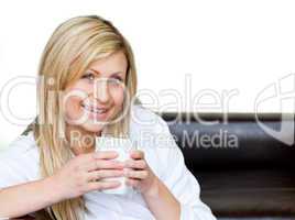 Self-assured woman holding a cup of coffee