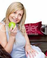 Bright woman eating an apple