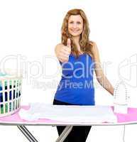 Handsome woman standing behind an ironing board with thumbs up