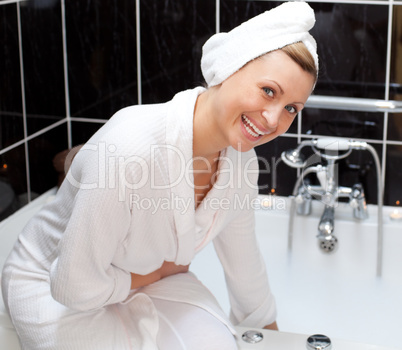 Laughing woman is having a bath