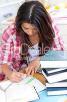 Young woman doing her homework