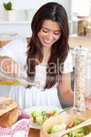 Attractive woman prepare a salad