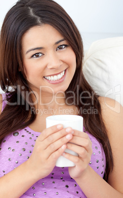 Beautiful woman holding a cup of coffee