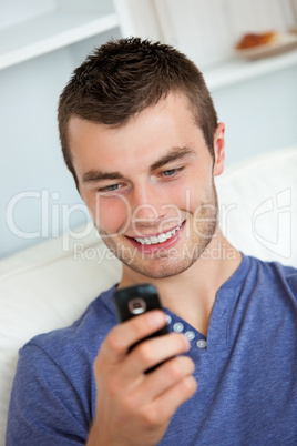 Attractive man writing a message