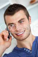 Handsome young man talking on phone