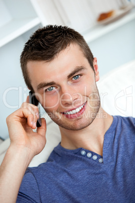 Friendly man on phone sitting on a couch