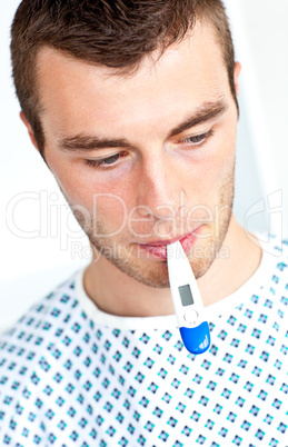 Sick man with a thermometer