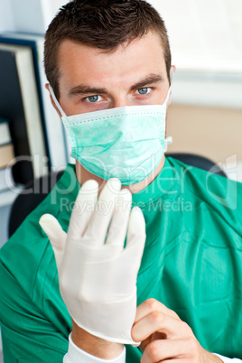 Serious surgeon with mask