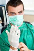 Serious surgeon with mask