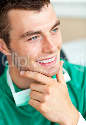 Handsome young surgeon thoughtful