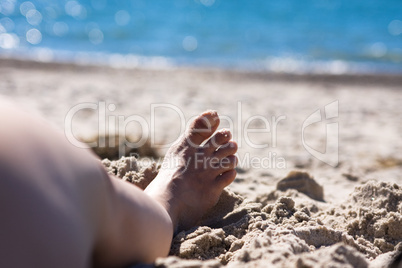 feet on the beach