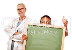 Female Doctor with Hispanic Child Holding Chalk Board