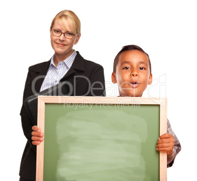 Hispanic Boy Holding Chalk Board and Female Teacher Behind