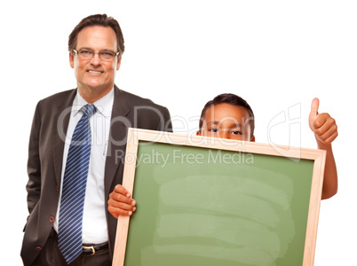 Hispanic Boy Holding Chalk Board with Male Teacher Behind