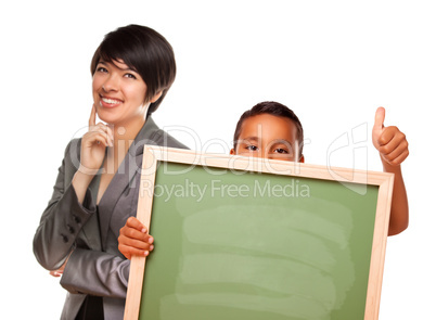 Hispanic Boy Holding Chalk Board and Female Teacher Behind