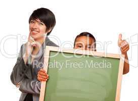 Hispanic Boy Holding Chalk Board and Female Teacher Behind