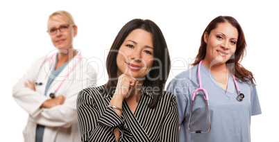 Hispanic Woman with Female Doctor and Nurse
