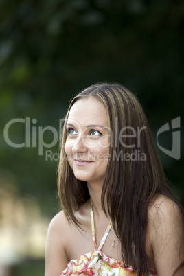 Young woman look up