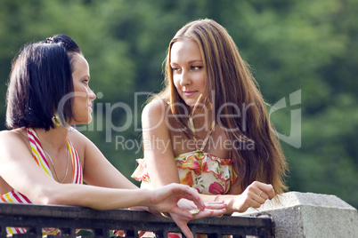 Two young woman in park