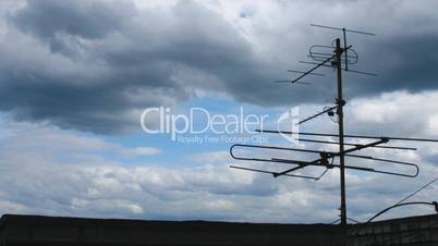 Antenna on roof and cloudscape time lapse