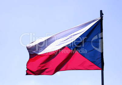 Flag of Czech republic blowing on blue sky