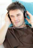 Handsome man with headphones listening to music