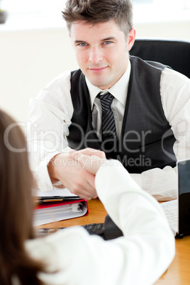 Handsome businessman closing a deal