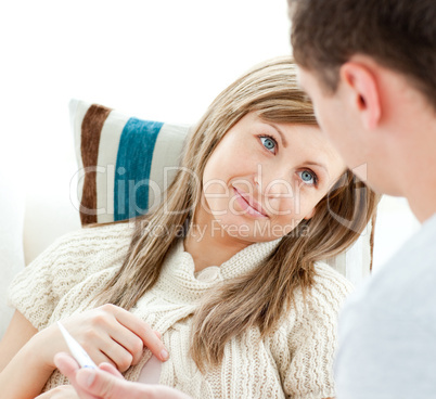 Smiling ill woman with her boyfriend holding pills
