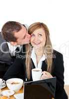 Attractive businessman kissing his bright girlfriend