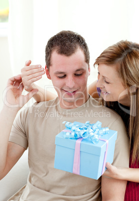 Smiling woman giving a present to her boyfriend