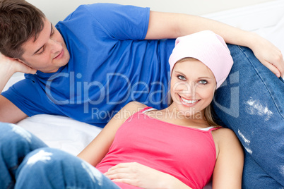 Portrait of a smiling  couple relaxing after painting a room