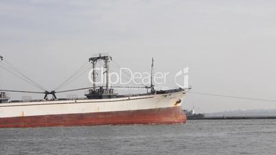 Cargo ship leaves port timelapse (Full HD)