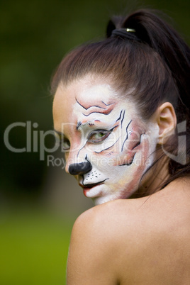 young woman with tigress face art