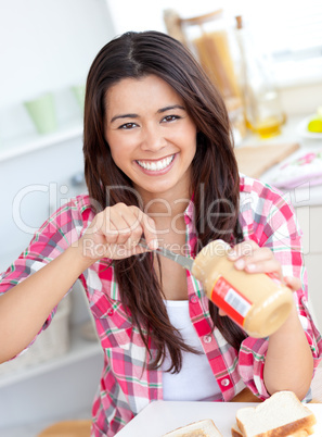 Concentrated young having a breakfast in the kitchen