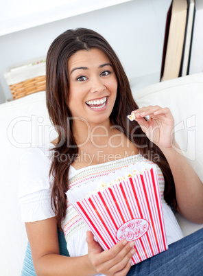 Portrait of a woman eating pop corn