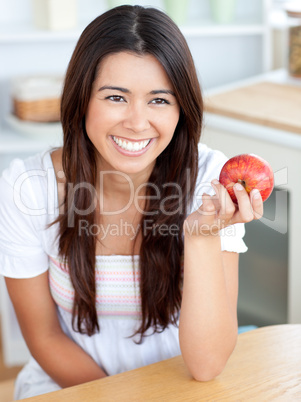 Attractive young woman holding a red an apple