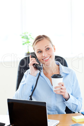 Beautiful female doctor talking on phone