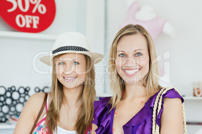 Cute women choosing clothes together