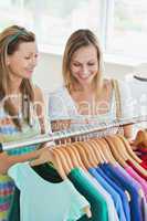 Caucasian women choosing clothes together