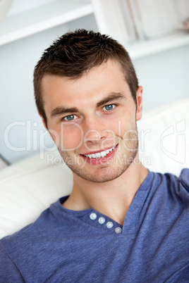 Young man is relaxing in the living-room