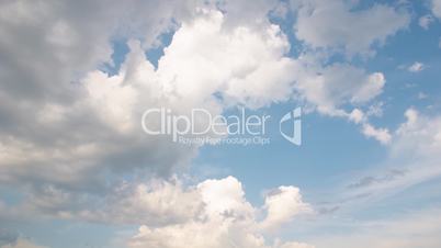 Multilevel white floating clouds on blue sky - motion background