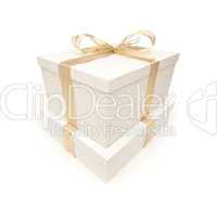 Stacked White Gift Boxes with Gold Ribbon Isolated