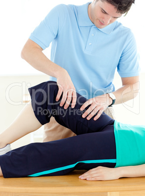 Young man doing fitness exercises with a patient