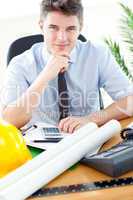 Young businessman in front of his desk