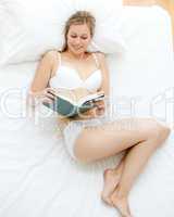 Concentrated woman reading a book