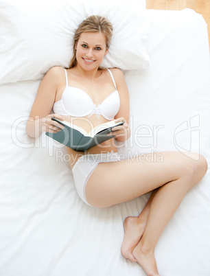 Charming woman reading a book