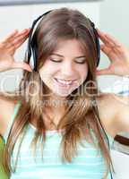 Good-looking girl listening to music